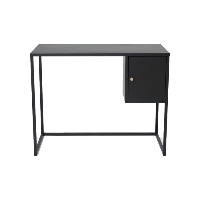 Bureau Bakal en métal noir avec un caisson à porte et poignée dorée, vu de face sur fond blanc