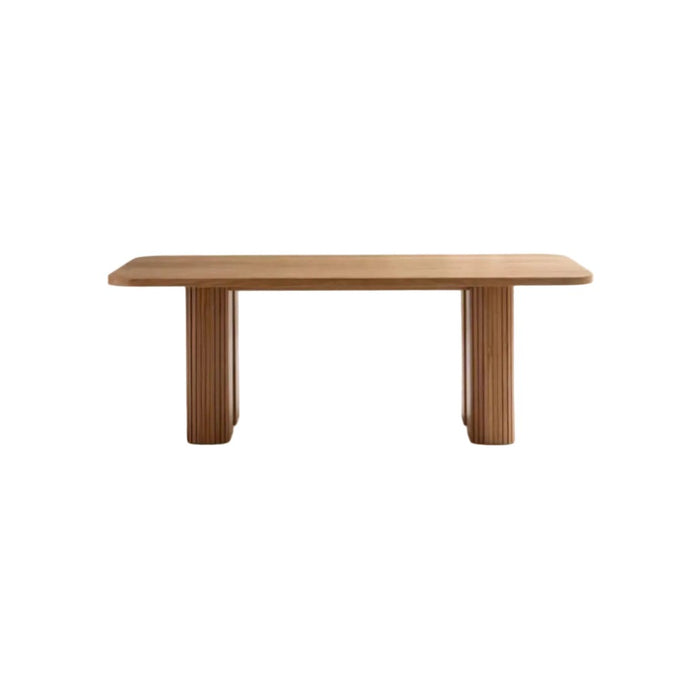 Table à manger Latti rectangulaire en chêne massif avec deux pieds cannelés, vue de face sur fond blanc